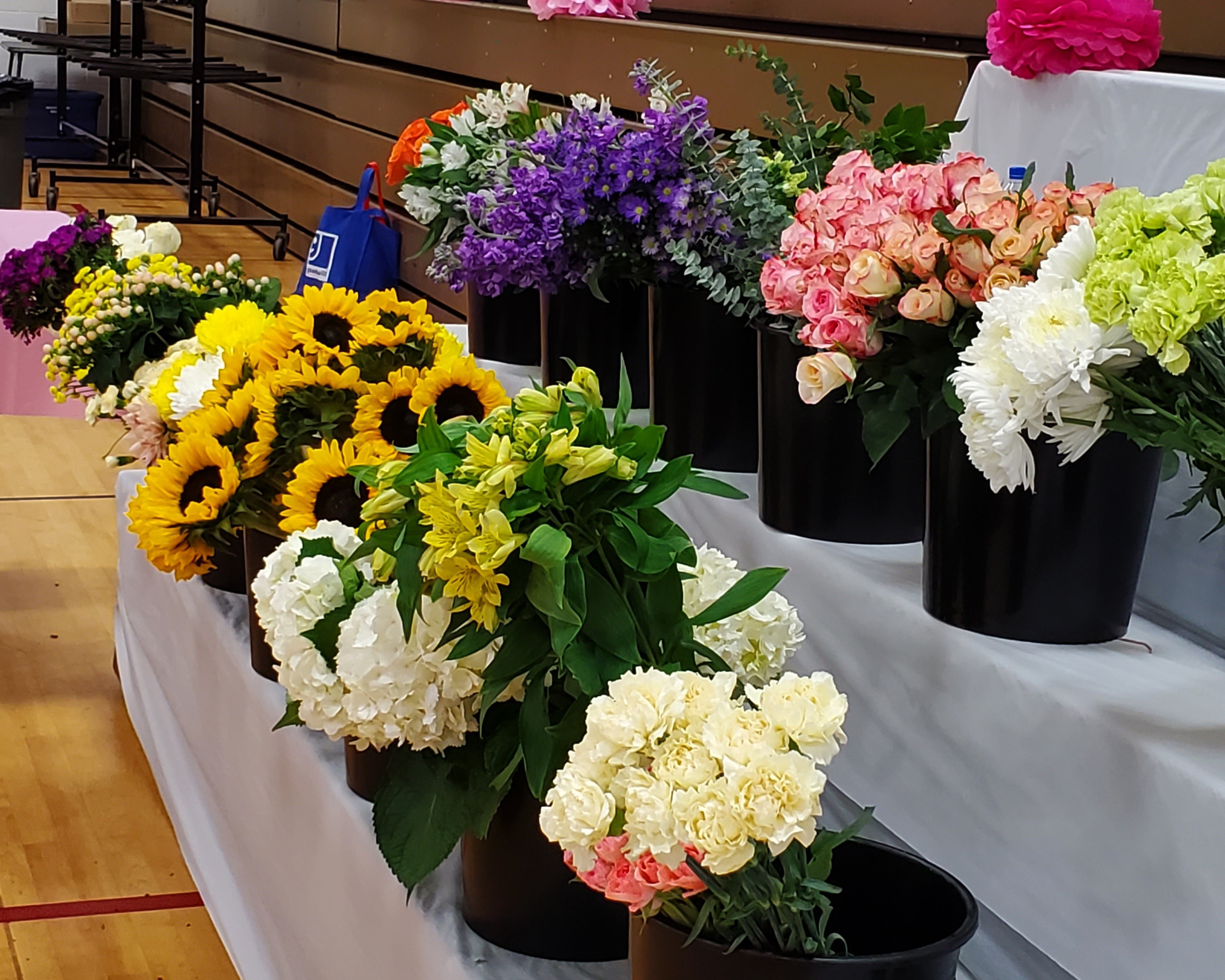 A photo of a variety of flowers about to be used to make bouquets