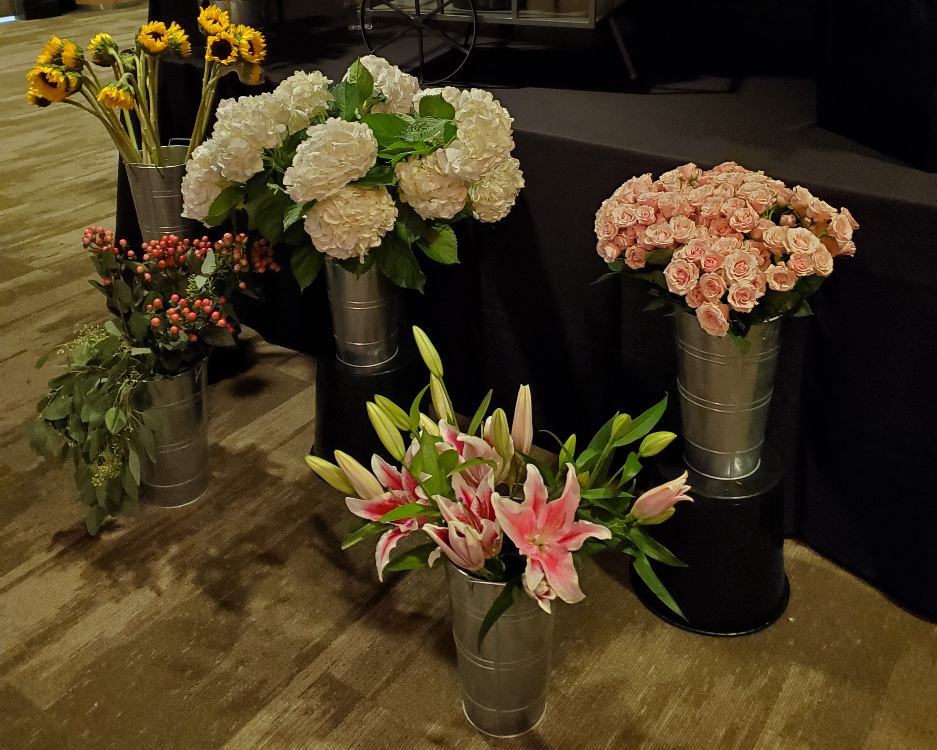 A photo of a variety of flowers about to be used to make bouquets