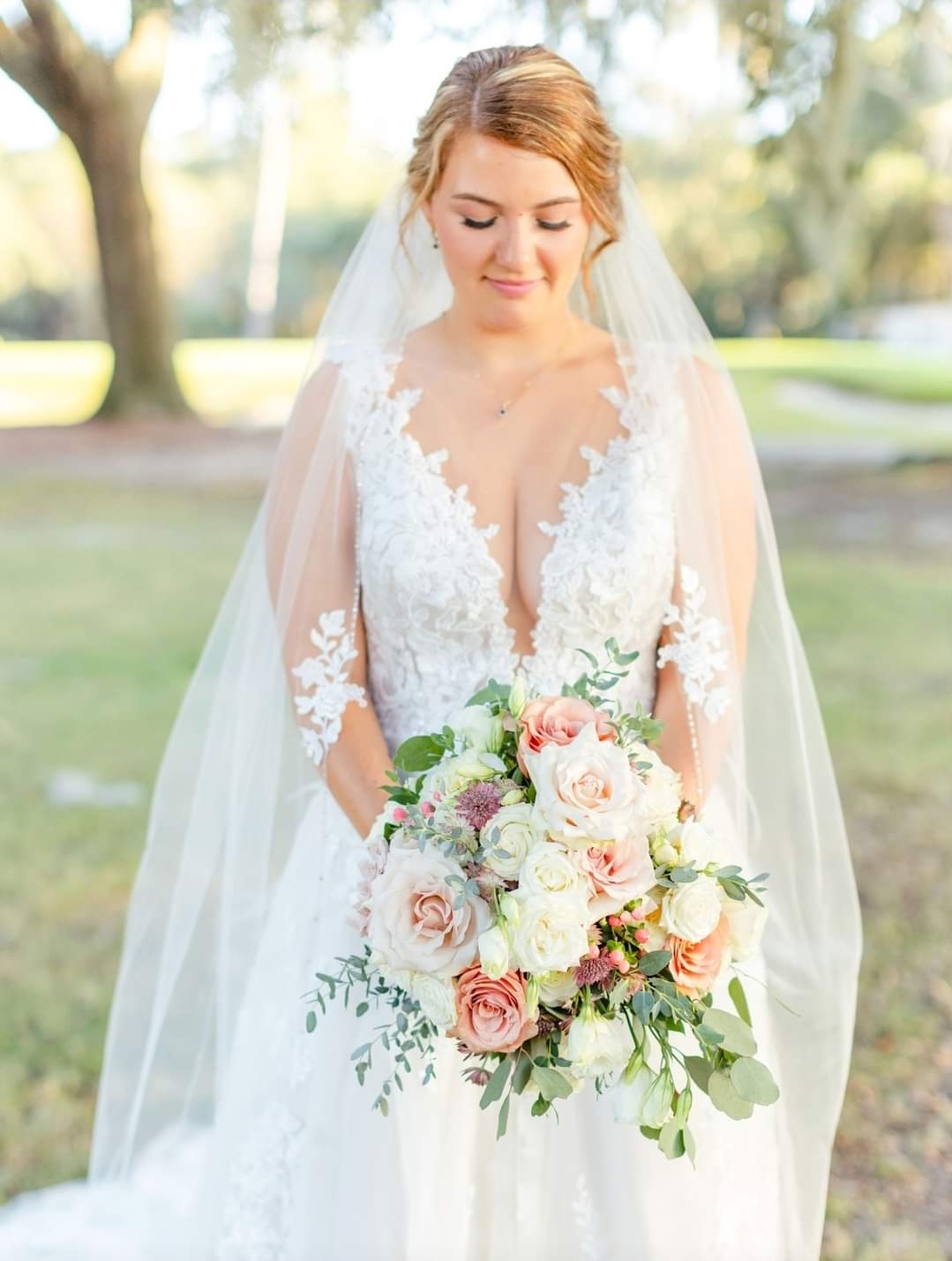 bride in wedding gown holding bouquet