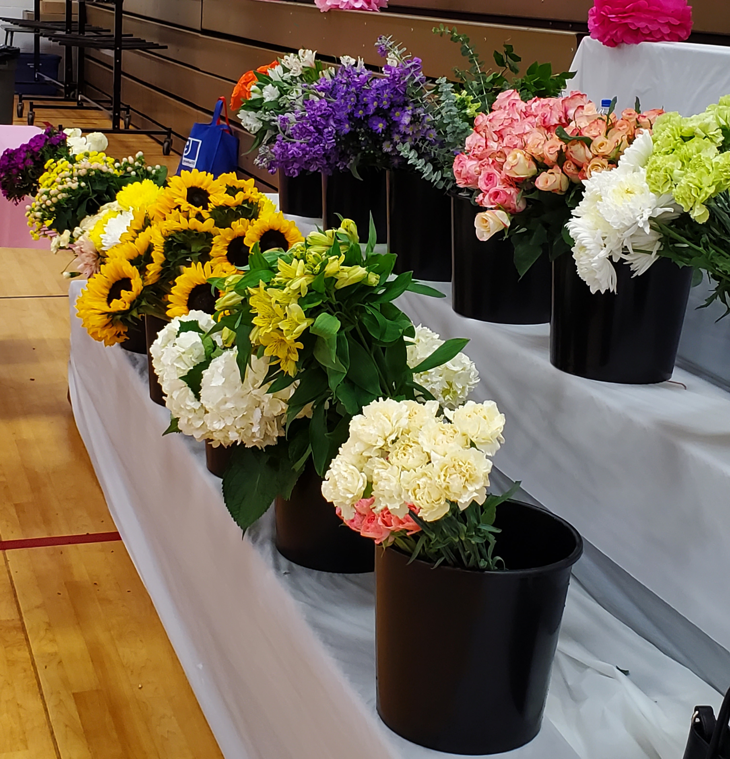 A photo of a variety of flowers about to be used to make bouquets